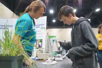 a student uses tools to practice the job of a lineman